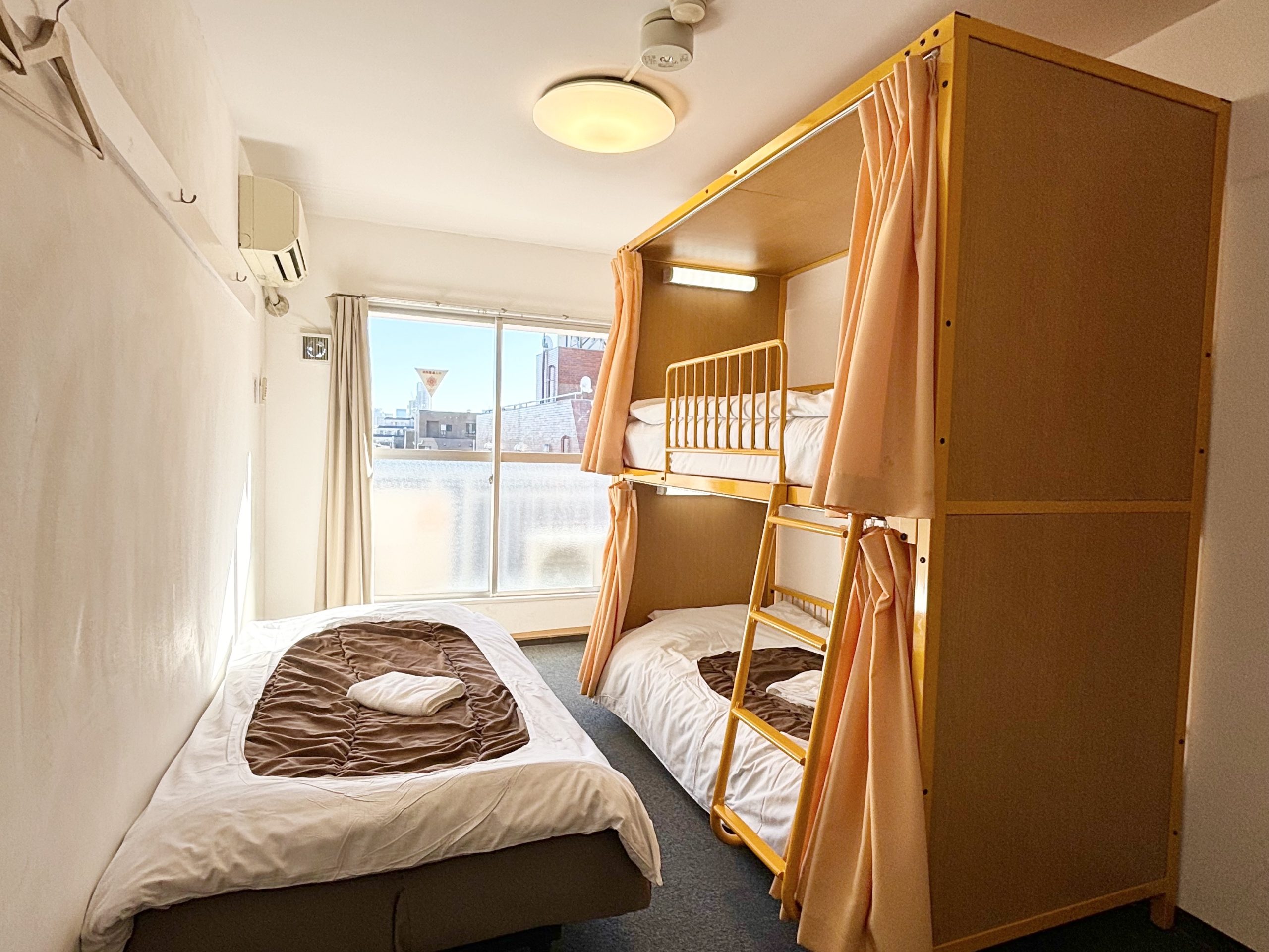 "Japanese Style Triple Room, ideal for families and groups at Sakura Hotel Nippori in Tokyo"