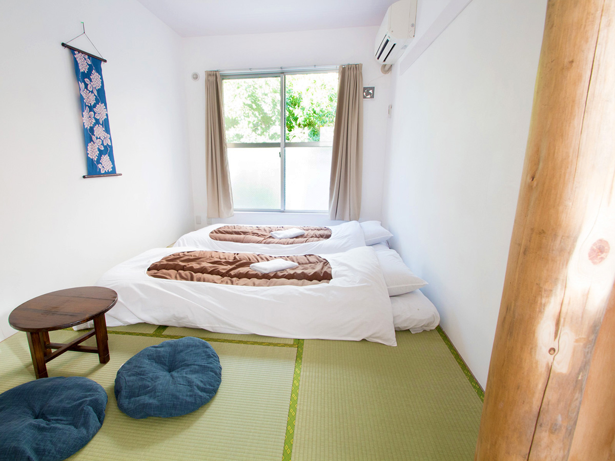 "Japanese Style Twin Room with tatami flooring and futons at Sakura Hotel Nippori in Tokyo"
