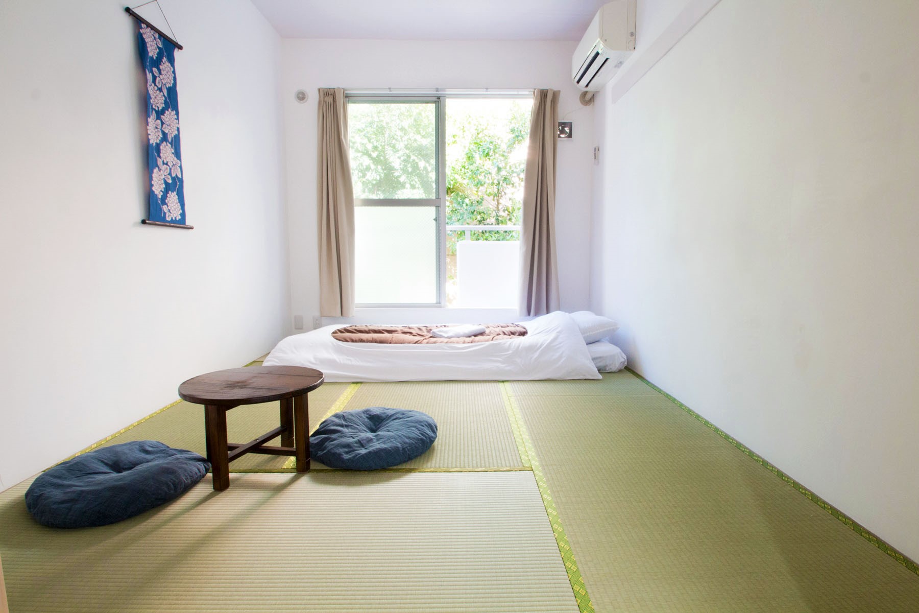 "Japanese Style Single Room with tatami flooring and futons at Sakura Hotel Nippori in Tokyo"
