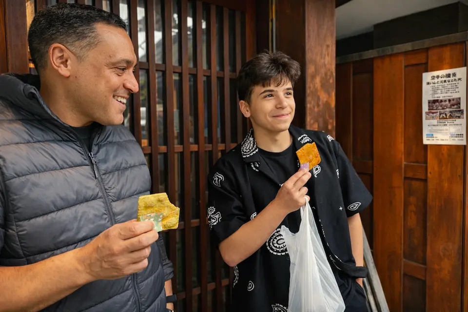 Family guest from Germany enjoying rice crackers